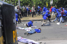 Rallies against job creation law turn violent as police clash with protesters