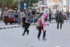 Police clash with jobs law protesters in Jakarta