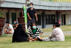Asymptomatic COVID-19 patients socialize with each other in a designated area during their time at the Patriot Candrabhaga Stadium isolation center in Bekasi, West Java, on October. 2. 2020. Patients are allowed to interact with each other under strict health protocols. JP/Dhoni Setiawan