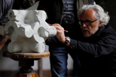 Mexican artist Gabriel Orozco works on an art piece during an interview with Reuters in Mexico City, Mexico, on October 3, 2020. 