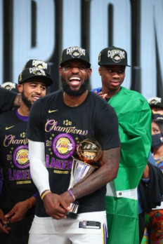 LeBron James #23 of the Los Angeles Lakers smiles after receiving The Bill Russell NBA Finals MVP Award prior to Game Six of the NBA Finals on Oct. 11, 2020 at AdventHealth Arena in Orlando, Florida. 