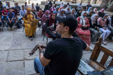 Egyptian religious singer Mahmoud al-Tohamy addresses his students during an Islamic chanting class, at Prince Taz Palace in the historic center of the capital Cairo, on Sept.29. The prominent singer has since 2014 established a school for Islamic chanting, commonly known an 