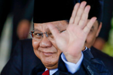 Prabowo Subianto gestures as he arrives at President Joko “Jokowi” Widodo’s second-term inauguration ceremony at the House of Representatives building in Jakarta on Oct. 20, 2019.