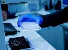 A laboratory worker tests COVID-19 PCR samples in a mobile laboratory truck in Soelden, Austria, on Oct. 15.   