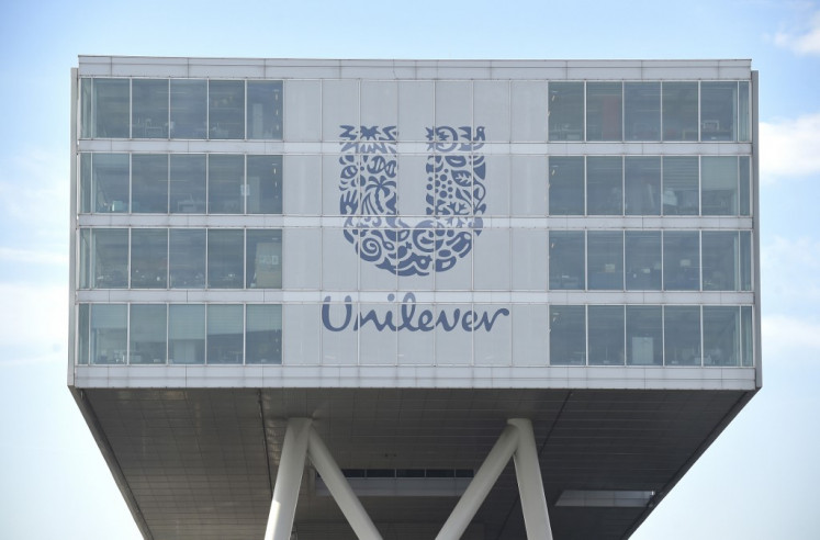 A picture taken on June 5, 2015 shows the logo of Unilever at the headquarters in Rotterdam. 