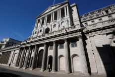 A security officer stands outside the Bank of England in London, UK, on March 23, 2020. 