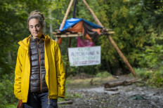 Carola Rackete, German captain of rescue vessel Sea-Watch 3, poses in front of a blockade inside the Dannenroeder forest near Dannenrod, central Germany, on October 15, 2020. 