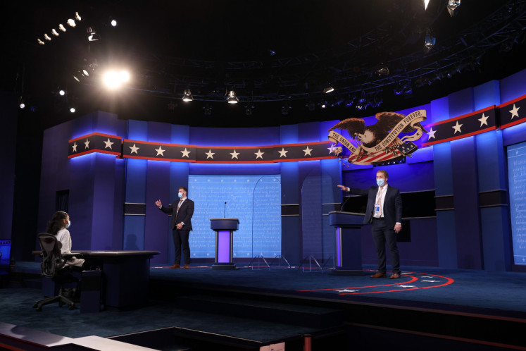 The stage is prepped, prior to the plexiglass dividers being removed, for U.S. President Donald Trump and Democratic presidential nominee Joe Biden's final presidential debate at Belmont University on Thursday in Nashville, Tennessee. This is the last debate between the two candidates before the election on Nov. 3. 
