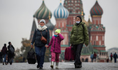 People walk in the Red Square in Moscow, Russia, on October 12, 2020. 