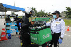 Grab tells staff it's 'in a position to acquire' after Gojek merger report