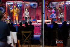 People are seen in plastic boxes onstage during The Atlanta Opera's production of 'Pagliacci' on October 22, 2020, in Atlanta, Georgia. 