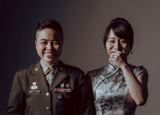 This undated and unlocated handout picture released by Taiwan’s Army Headquarters on Tuesday shows a Taiwanese soldier (left) and her partner posing for a wedding photo. Two Taiwanese soldiers and their civilian same-sex partners will tie the knot at a mass wedding hosted by the military on Friday in another gay rights landmark in Asia.
