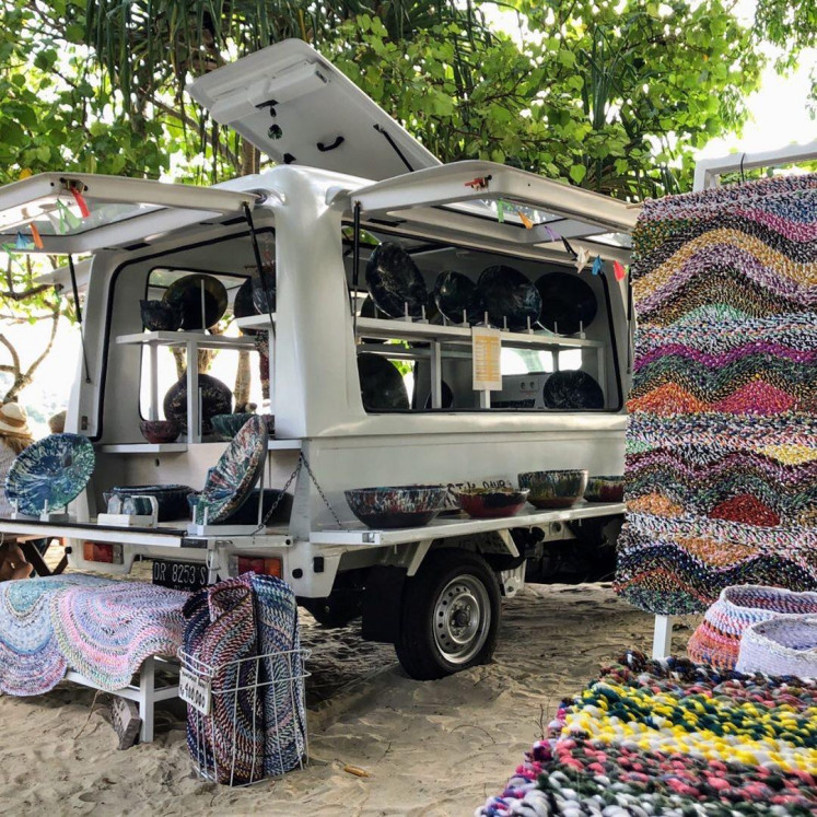 Eco-friendly bazaar: Plastik Kembali, a collective that recycles plastic waste into design-focused art and
goods based in Lombok, West Nusa Tenggara, displays its items made out of recycled plastic in mobile
shops using trucks like these amid the COVID-19 pandemic.