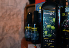 This picture taken on October 19, 2020 shows bottles of extra virgin olive oil displayed in the house of Bosnian olive farmer Jure Susac near the South-Western Bosnian town of Ljubuski on October 19, 2020. 