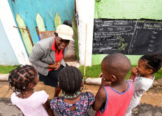 Jamaican teacher turns Kingston walls into blackboards