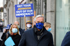 EU chief Brexit negotiator Michel Barnier, wearing an EU flag-themed facemask due to the COVID-19 pandemic, leaves the conference center in London on Oct.28 to return to his hotel as he attends the latest round of Brexit trade talks with the UK. Britain and the European Union launched an all-out round of Brexit talks vowing to work round the clock to seal a trade deal in the slender time left.
