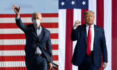 This combination of pictures created on Oct. 30, 2020 shows United States Democratic presidential nominee and former Vice President Joe Biden waves to supporters before speaking at a Drive-In rally at Dallas High School, in Dallas, Pennsylvania, on Oct. 24, 2020, and US President Donald Trump arrives to hold a Make America Great Again rally as he campaigns in Gastonia, North Carolina, on Oct. 21, 2020.
