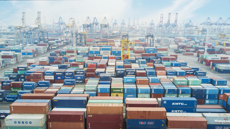Containers, cranes and ships are seen at Tanjung Priok Port in North Jakarta in this undated photo..