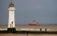 The RSS Sir David Attenborough sails past Perch Rock lighthouse as it leaves Liverpool to begin sea trials in New Brighton, Britain, on November 3, 2020. 