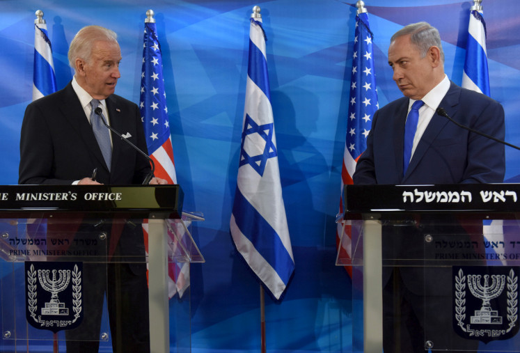 Then US Vice President Joe Biden (left) and Israeli Prime Minister Benjamin Netanyahu look at each other as they deliver joint statements during their meeting in Jerusalem March 9, 2016. 