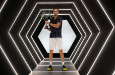 Russia's Daniil Medvedev poses with the trophy as he celebrates winning the final against Germany's Alexander Zverev at Paris Masters tournament on Sunday.