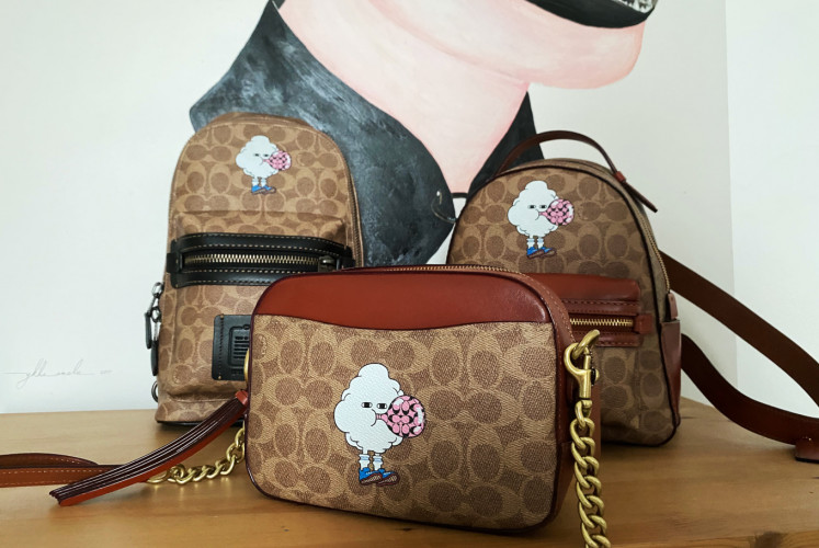 Coach's 'Art of Signature' collection featuring Ykha Amelz's Sunday character. 