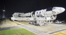 A SpaceX Falcon 9 rocket with the company's Crew Dragon spacecraft onboard is seen as it is rolled out of the horizontal integration facility at Launch Complex 39A as preparations continue for the Crew-1 mission, November 9, 2020, at NASA’s Kennedy Space Center in Florida. 