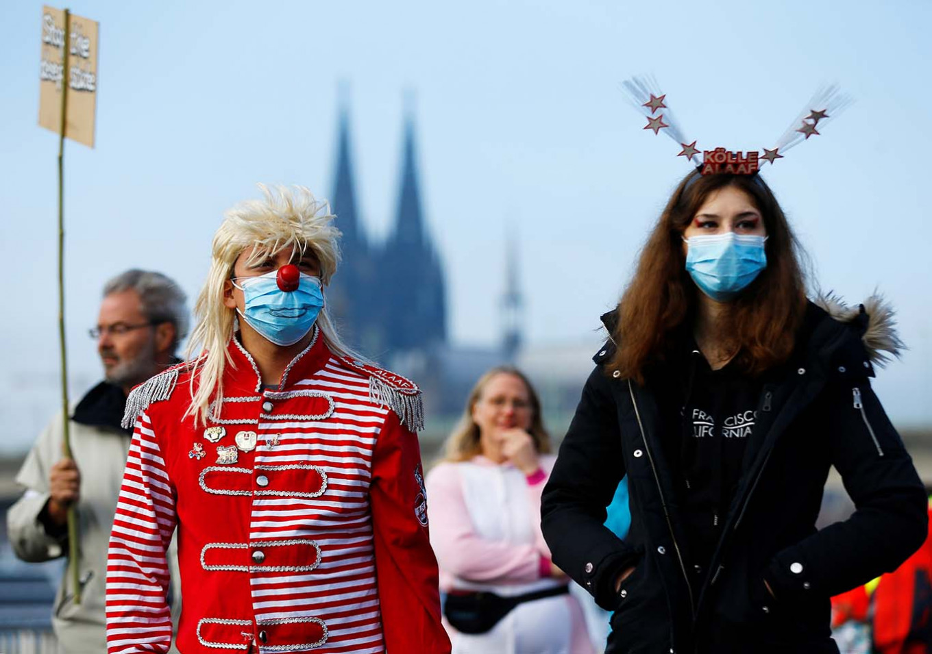 Carnival revellers attend a demonstration against the government's restrictions as the traditional celebrations for the start of the famous carnival season are officially cancelled due to the spread of the coronavirus disease (COVID-19) in Cologne, Germany, November 11, 2020. 