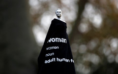 The Mary Wollstonecraft statue 'Mother of feminism' by artist Maggi Hambling is seen covered with a T-shirt in Newington Green, London, Britain, on November 11, 2020. 