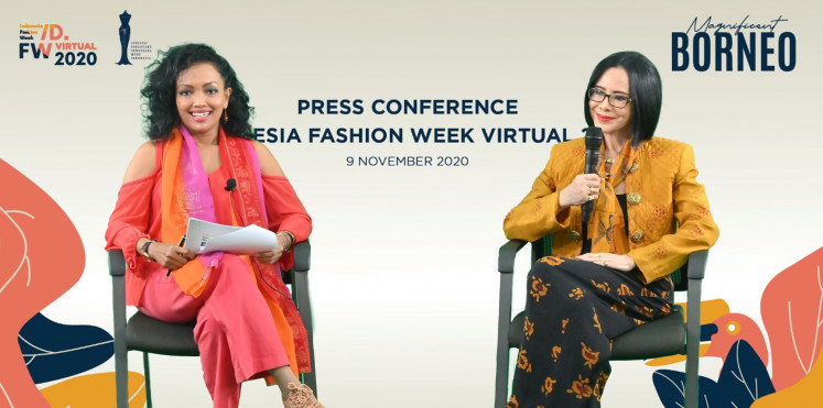 All smiles: Fashion designer and IFW president Poppy Dharsono (right) believes that fashion can be used as a tool for diplomacy. 