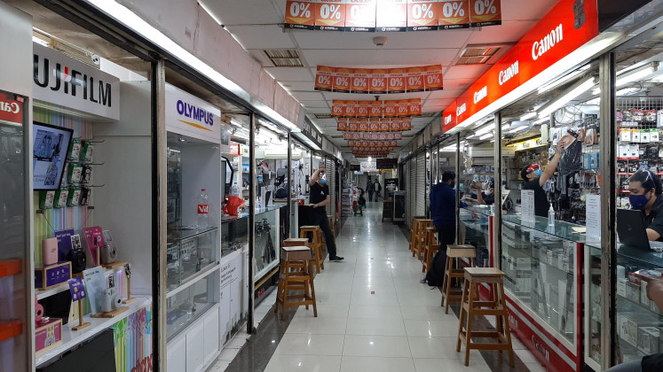 Different options: Camera shops are lined up in Pasar Baru, Central Jakarta. New and second-hand analogue and digital cameras can be found for sale in the shops.