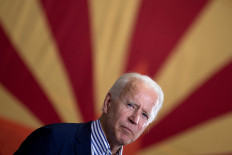  In this file photo taken on Oct.8 Democratic presidential candidate former US Vice President Joe Biden pauses while speaking to supporters in front of an Arizona state flag, at the United Brotherhood of Carpenters and Joiners of America's training center in Phoenix, Arizona. Joe Biden has won the state of Arizona, US networks said late Thursday, further cementing his lead in the Electoral College and flipping the state Democratic for the first time since 1996.
Arizona gives Biden a 290-217 lead over Trump in the Electoral College that ultimately decides the presidency, with 270 needed to win the White House.
