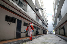 Malaysia sees another record in COVID-19 infections, deaths