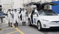 This NASA photo shows NASA astronauts Mike Hopkins, Victor Glover, Shannon Walker(behind, not seen), and Japan Aerospace Exploration Agency (JAXA) astronaut Soichi Noguchi, wearing SpaceX spacesuits, as they prepare to depart the Neil A. Armstrong Operations and Checkout Building to depart for Launch Complex 39A during a dress rehearsal prior to the Crew-1 mission launch, on November 12, 2020, at NASA’s Kennedy Space Center in Florida. NASA’s SpaceX Crew-1 mission is the first operational mission of the SpaceX Crew Dragon spacecraft and Falcon 9 rocket travel to the International Space Station as part of the agency’s Commercial Crew Program. NASA astronauts Mike Hopkins, Victor Glover, and Shannon Walker, and astronaut Soichi Noguchi of the Japan Aerospace Exploration Agency (JAXA) are scheduled to launch at 7:49 p.m. EST on November 14,2020 from Launch Complex 39A at the Kennedy Space Center.