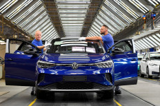 Technical employees work in the final inspection at the production line for the electric Volkswagen model ID. 4, in Zwickau, Germany, on September 18, 2020. 