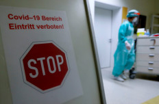 A warning sign which reads 'COVID-19 area no entry!' is seen at the COVID-19 isolation ward where patients suffering from the coronavirus disease are treated at DRK Kliniken Berlin Mitte hospital in Berlin, Germany, on November 11, 2020. 