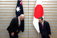 Australia's Prime Minister Scott Morrison (left) and Japan's Prime Minister Yoshihide Suga (right) bow at the start of their meeting at Suga's official residence in Tokyo on November 17, 2020. 