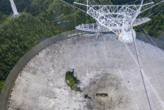 This aerial view shows a hole in the dish panels of the Arecibo Observatory in Arecibo, Puerto Rico, on November 19, 2020.  