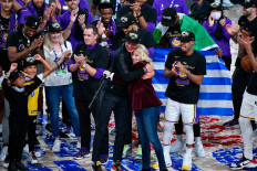  Rob Pelinka of the Los Angeles Lakers and Jeanie Buss of the Los Angeles Lakers hug following Game Six of the NBA Finals on Oct.11 in Orlando, Florida at AdventHealth Arena. 