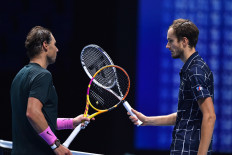 Russia's Daniil Medvedev (right) gestures to Spain's Rafael Nadal (left) after winning their men's singles semi-final match on day seven of the ATP World Tour Finals tennis tournament at the O2 Arena in London on Saturday. Medvedev won the match 3-6, 7-6, 6-3.
