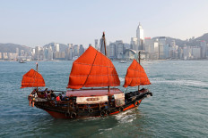A traditional wooden tourist junk boat 'Dukling', sails in the waters of Victoria Harbour, during the COVID-19 pandemic, in Hong Kong, China, on October 31, 2020.