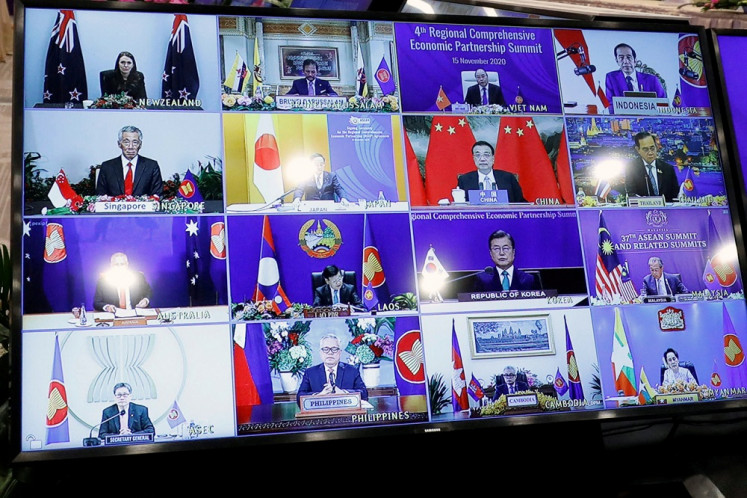 Leaders of ASEAN and its strategic partners are seen on a screen as they attend the fourth Regional Comprehensive Economic Partnership Summit as part of the 37th ASEAN Summit held online from Hanoi on Nov. 15, 2020. 