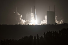 A Long March 5 rocket carrying China's Chang'e-5 lunar probe launches from the Wenchang Space Center on China's southern Hainan Island on November 24, 2020, on a mission to bring back lunar rocks.