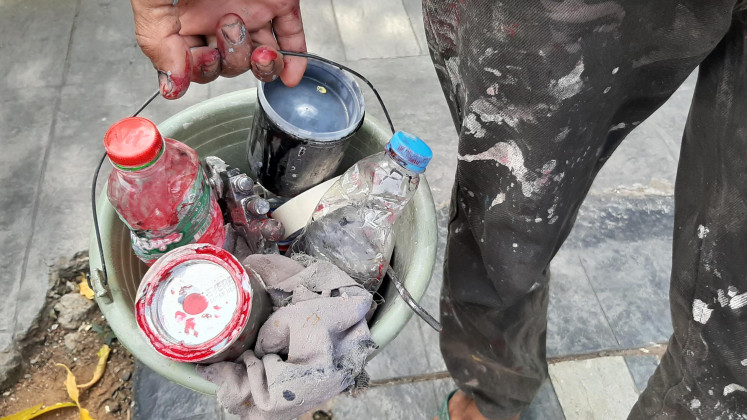 Working tools: A bucket is filled various tools for the mechanics’ repair work.