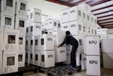 Workers from the Depok General Elections Commission (KPU) stack ballot boxes at a warehouse in Cimanggis district, Depok, West Java, on Nov. 25. The Depok KPU has started distributing supplies throughout the city in preparation for the 2020 regional elections on Dec 9. JP/P.J.Leo