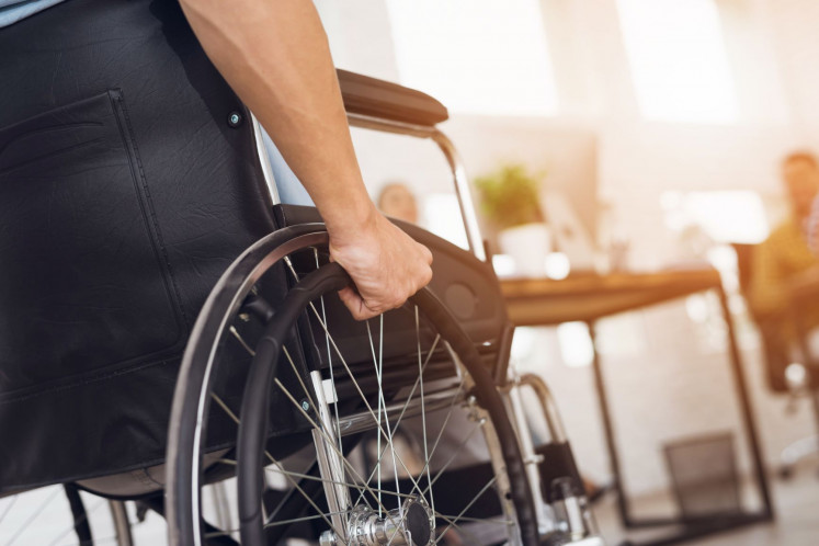 A wheelchair user is pictured in this stock photo.