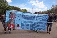 Papuan activists stage a protest in Jakarta on Dec. 1, 2020, to commemorate a day they consider to be West Papua liberation day.