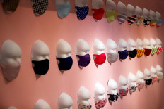 Tokyo pop-up mask store lures shoppers with festive face coverings