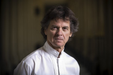 Star-studded French Chef Guy Martin poses outside his restaurant Le Grand Vefour in Paris on June 19, 2015. 