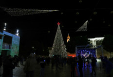 Bethlehem lights up Christmas tree as virus rules keep crowds away 